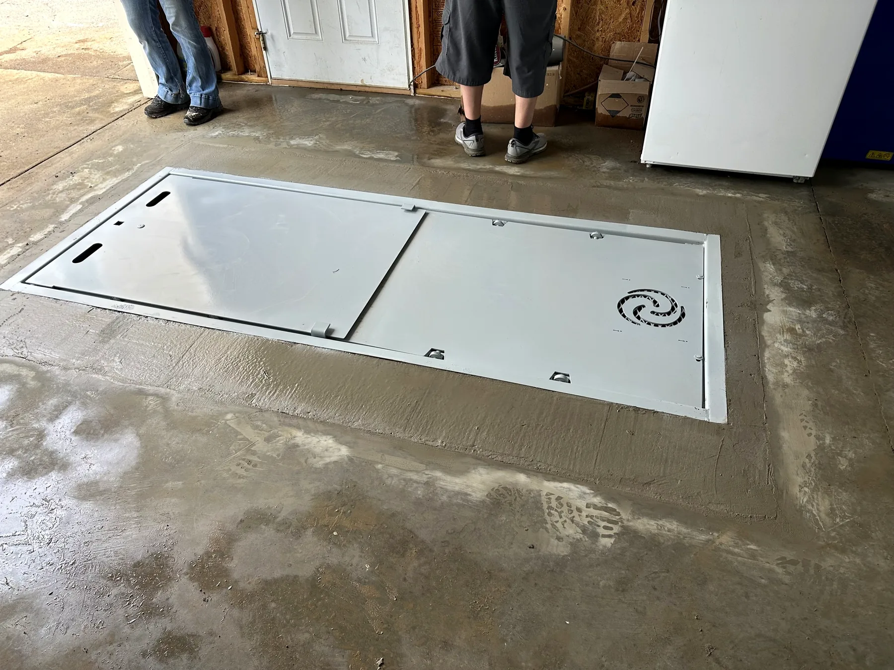 Completed flush-mount garage storm shelter installation in Tennessee